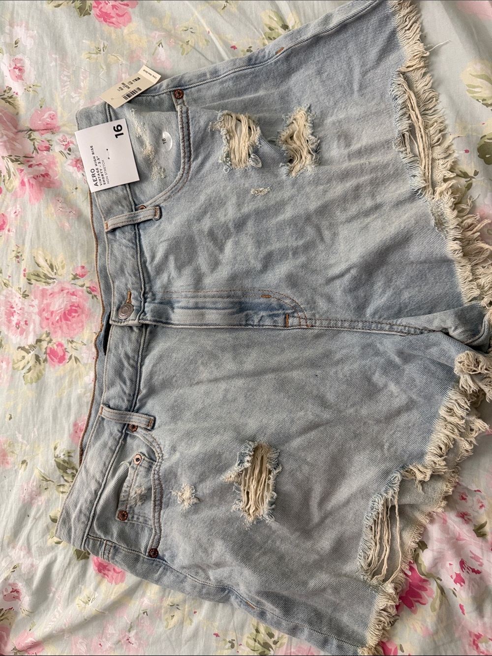 High-Rise Light Blue Distressed Denim Shorts